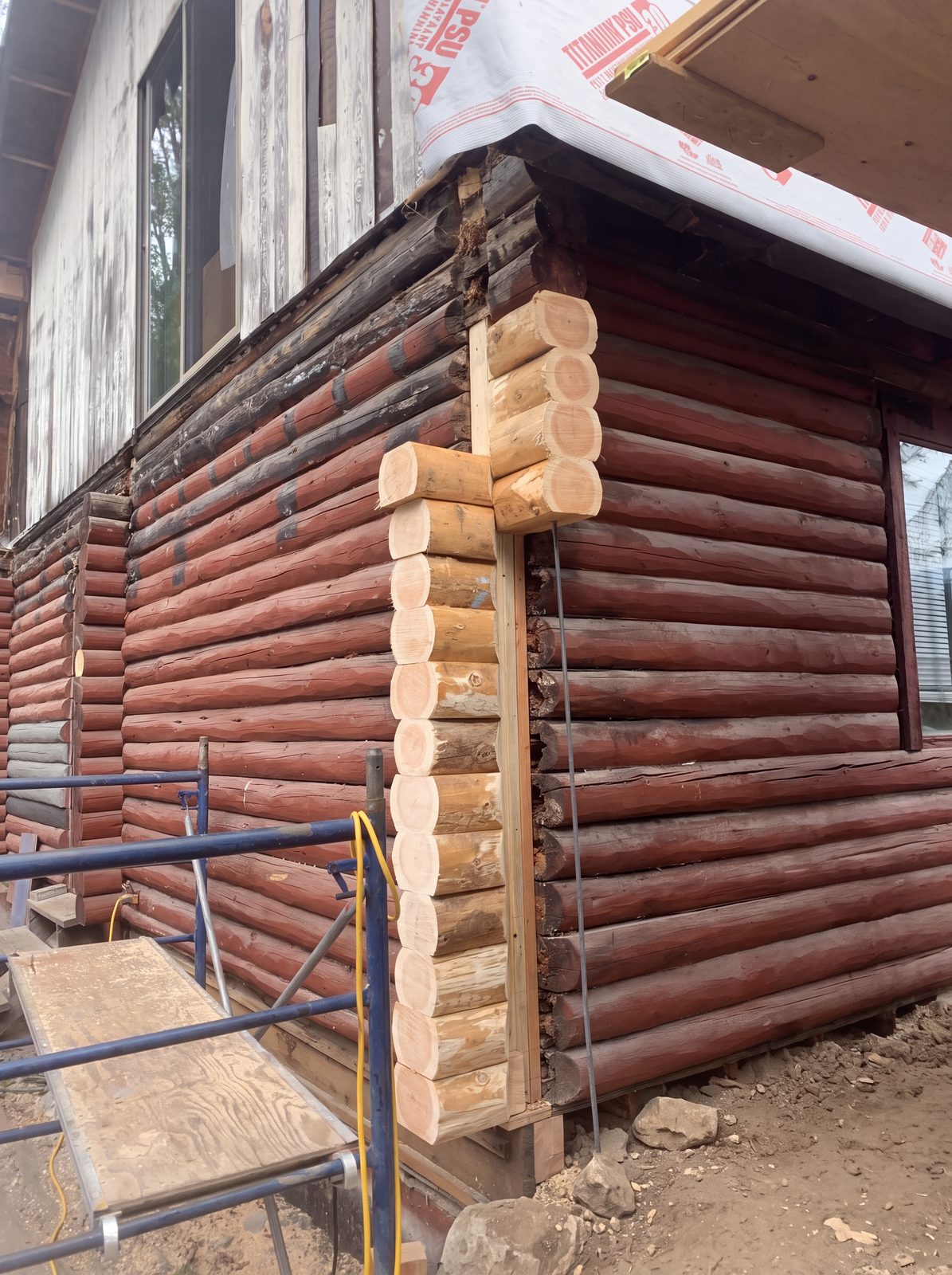 Log restoration in the Sea to Sky - new log ends spliced into a rotted log home corner